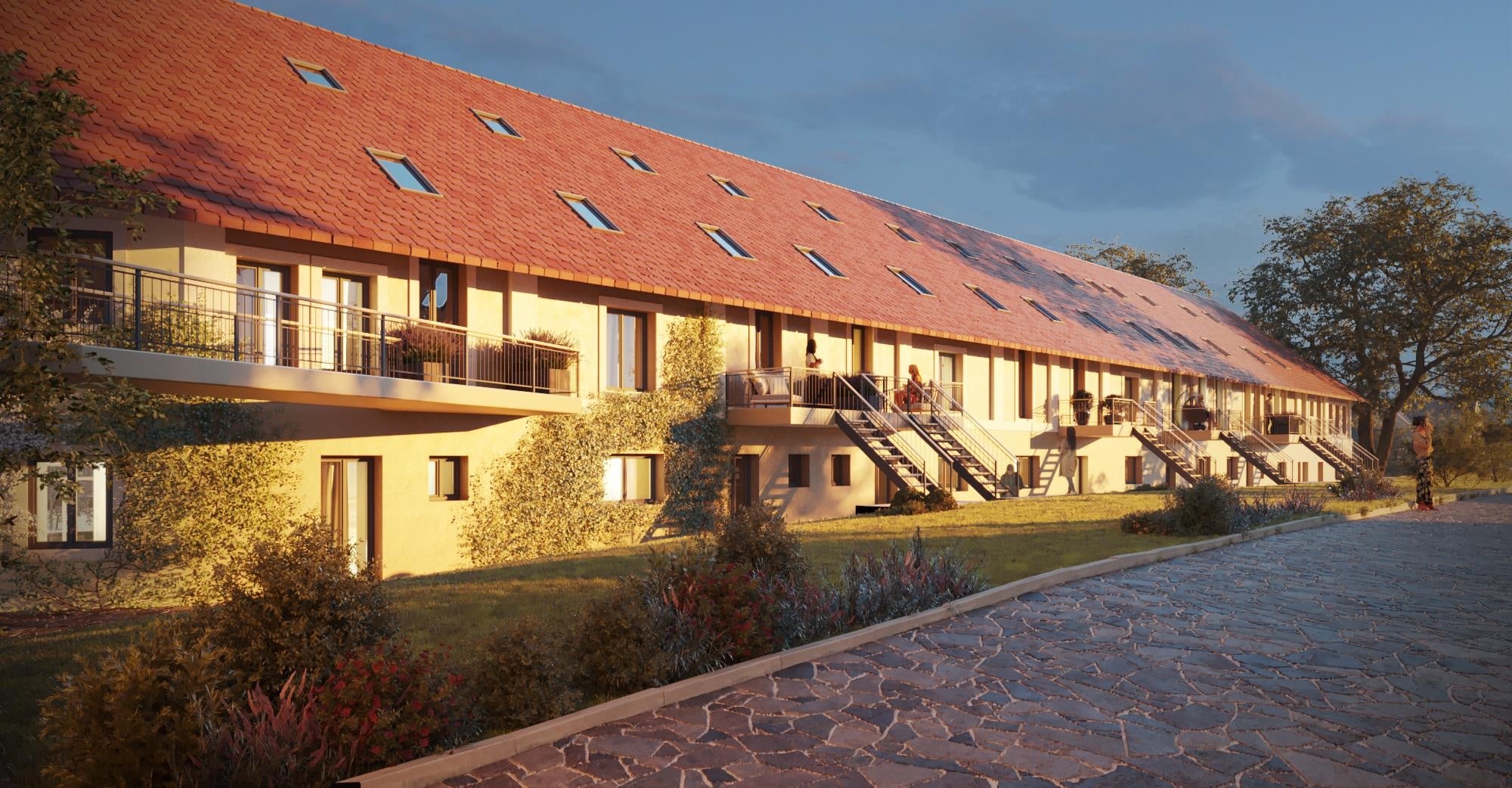 Abendliche Visualisierung des Schwerthofs mit Außentreppen, Balkonen und gepflastertem Natursteinvorplatz