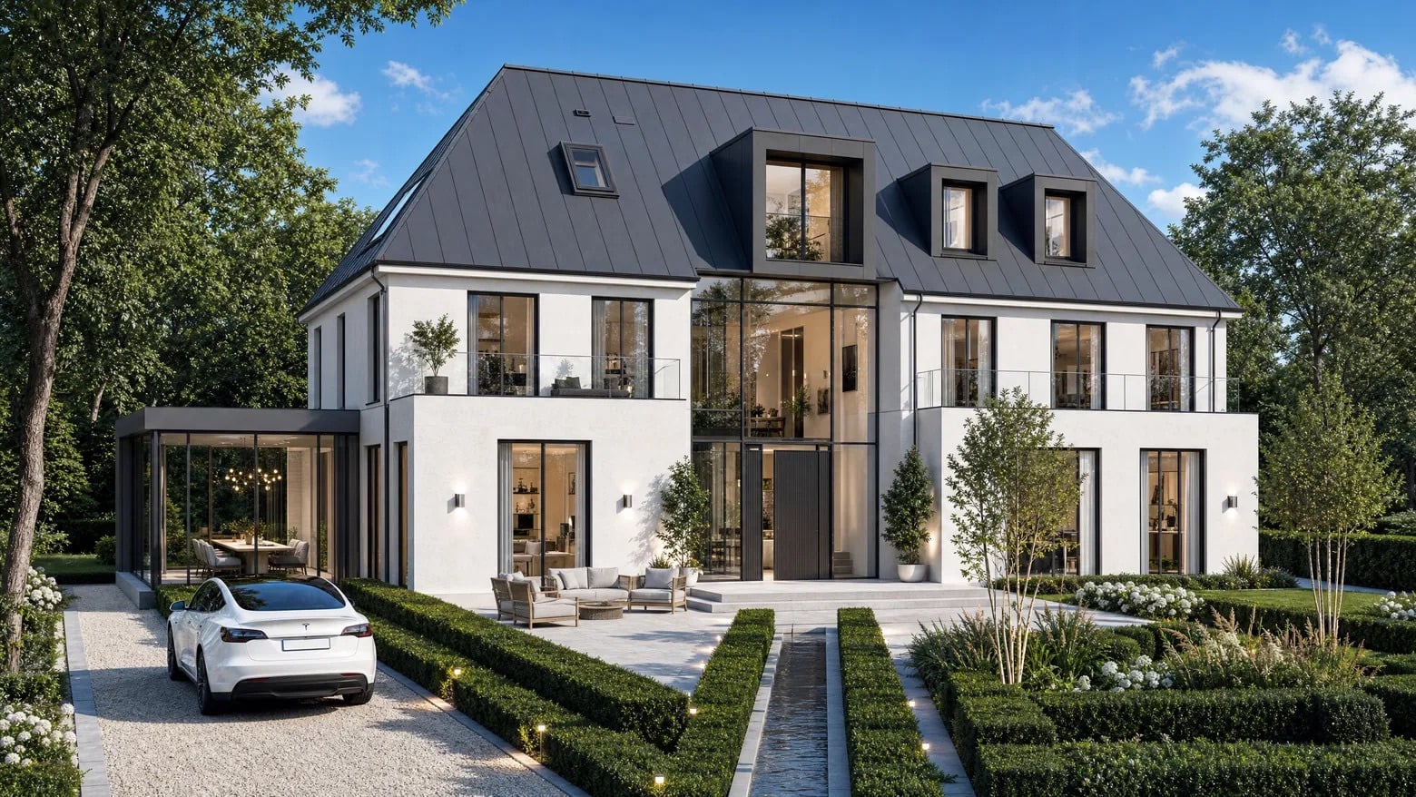 Parkresidenz Billtal — Moderne Villa mit dunklem Klinker, Satteldach in Zink und verglastem Essbereich am formalen Garten